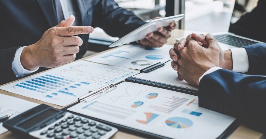 Two investors discussing forming an ETVE holding company in Spain