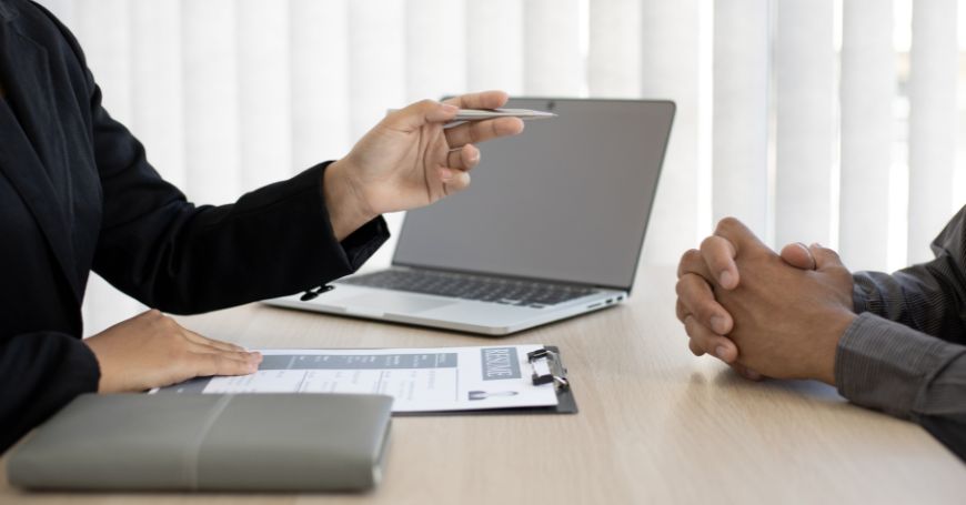 Professional conversation reviewing compliance issues with employer of record in spain