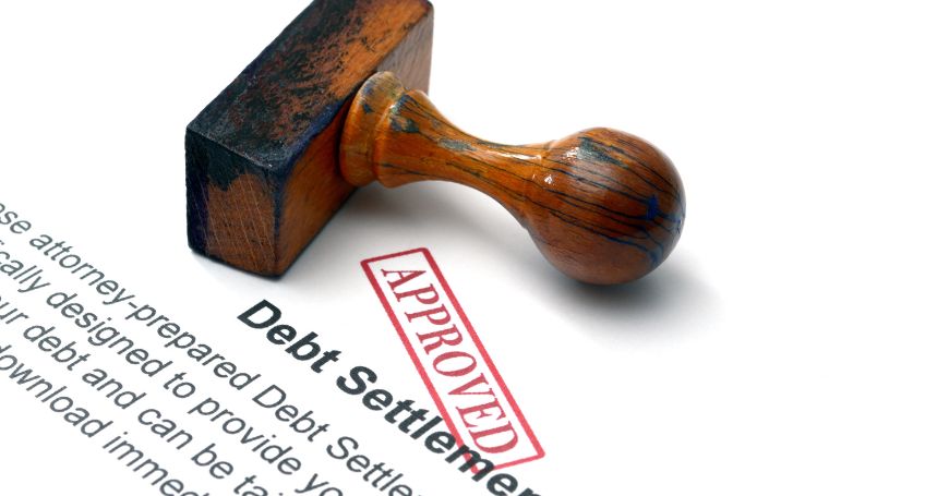 Rubber stamp marked “approved” on a debt settlement document related to Commercial Debt Collection in Spain